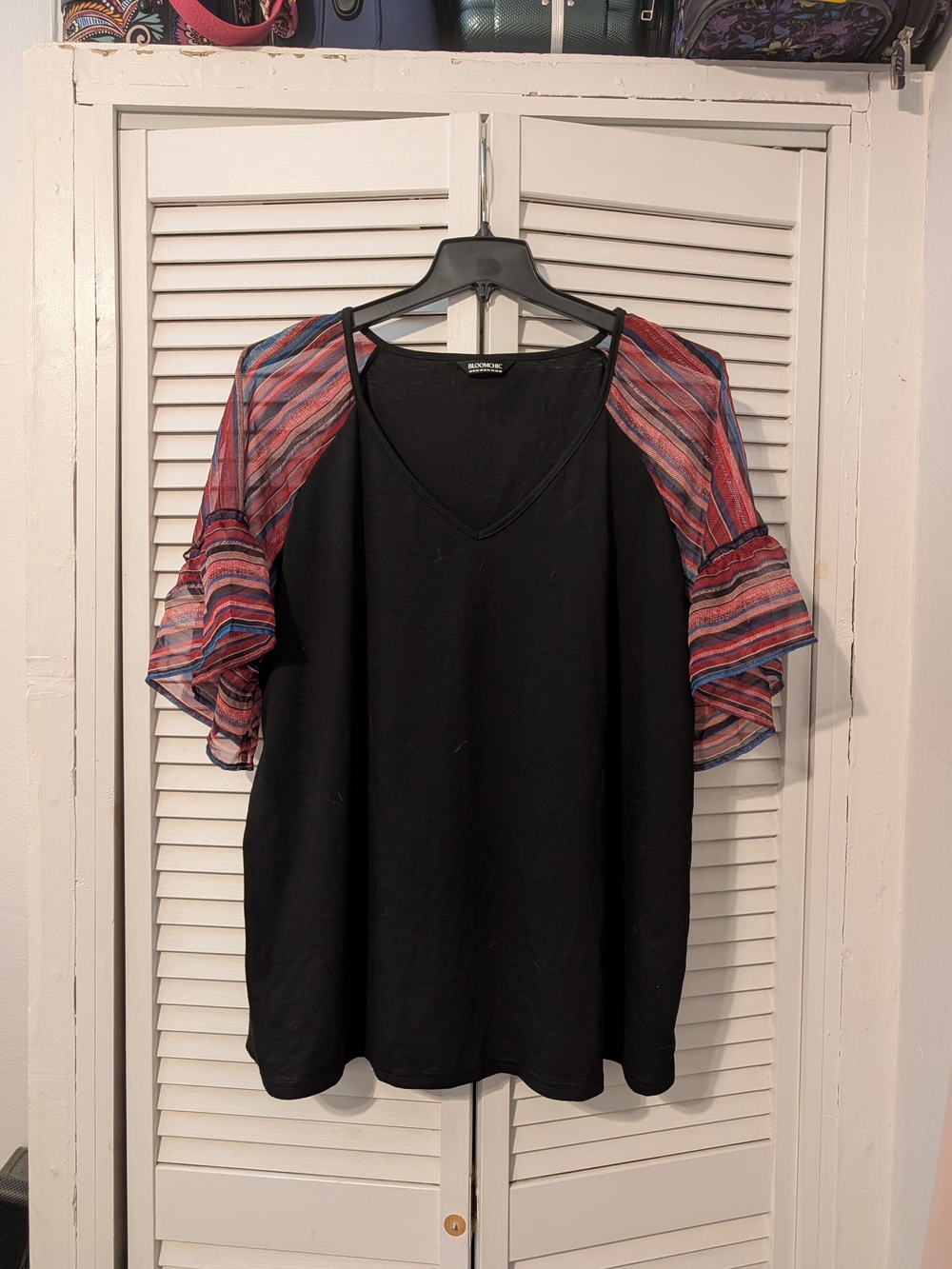 BloomChic Black V-Neck Top with Pink and Blue Striped Ruffle Sleeves